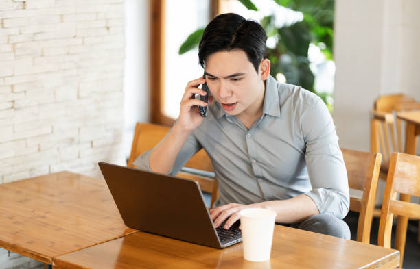 istock Young business man working at a coffee shop 2162127303