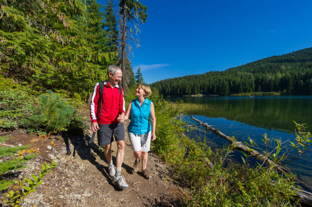 istock Senior couple explore lakeshore together 2162127963