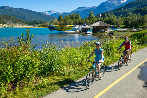 istock Senior couple explore lakeshore together on bicycles 2162127966