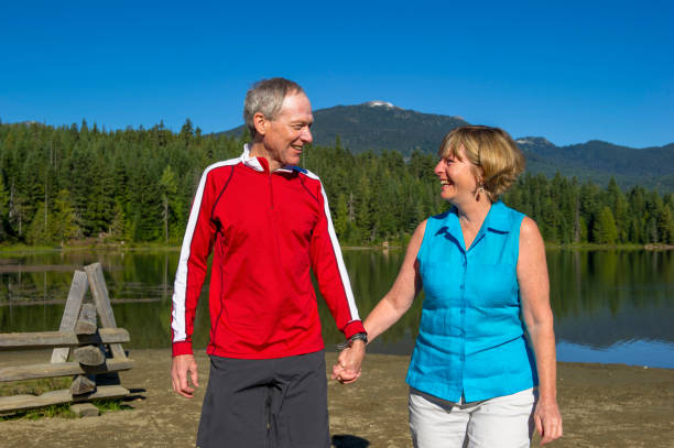 istock Senior couple explore lakeshore together 2162128034