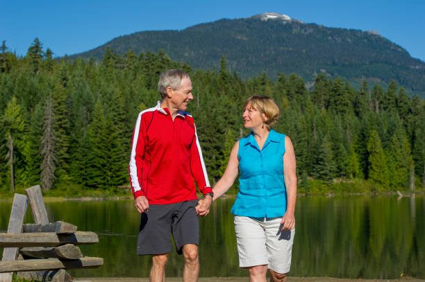 istock Senior couple explore lakeshore together 2162128157