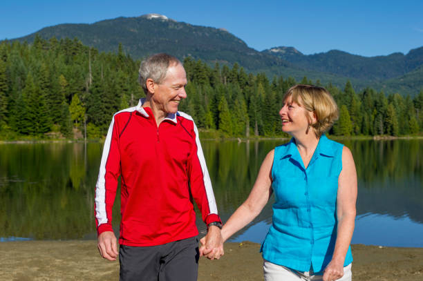 istock Senior couple explore lakeshore together 2162128160