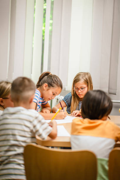 istock Young students paint and draw on class in the classroom 2162129089