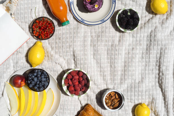 istock Picnic blanket with fresh fruit and snacks, flay lay view 2162129637