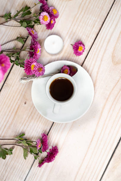 istock Autumn composition. Cup of coffee, notepad, fresh flowers on white background. Autumn, fall concept. Flat lay, top view, copy space 2162129714