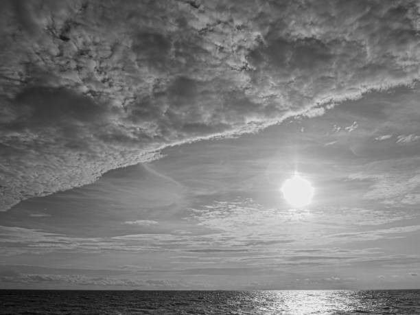 istock Beautiful sea waves with foam and sky, front view. Monochrome image 2162130184