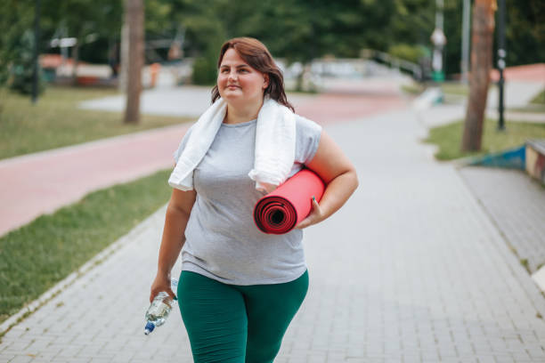 istock Satisfied Plus Size Woman Taking a Break After Exercise 2162130332