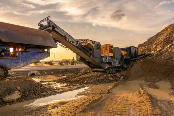 istock Heavy and mobile machinery in a quarry to transform stone into construction material 2162130407