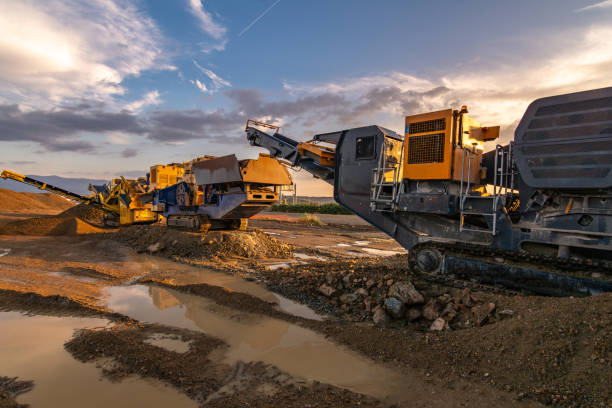 istock Heavy and mobile machinery in a quarry to transform stone into construction material 2162130412