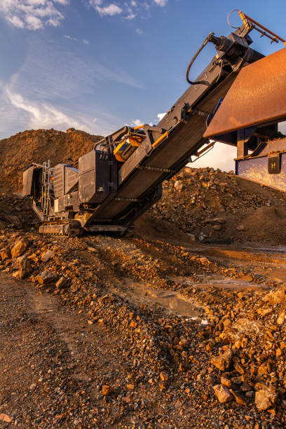 istock Heavy and mobile machinery in a quarry to transform stone into construction material 2162130418