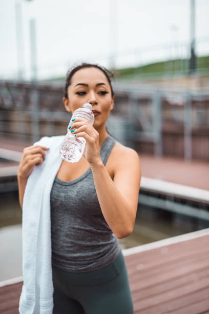 istock fitness woman using towel after the training 2162130563