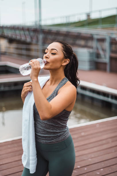 istock fitness woman using towel after the training 2162130593