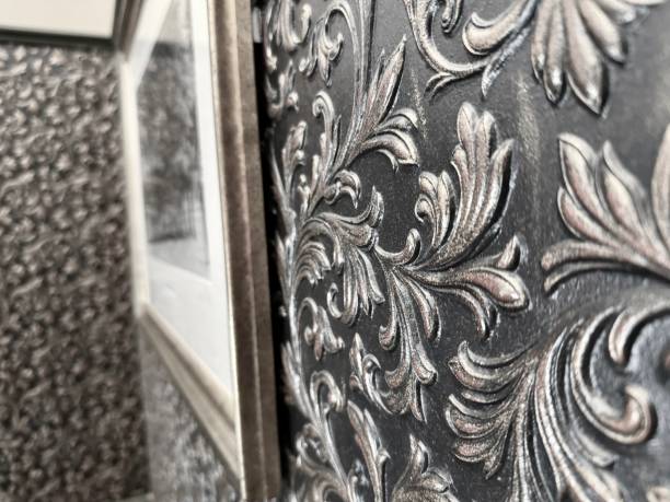 istock Ornate interior wall decor design with a picture frame in the background 2162133390