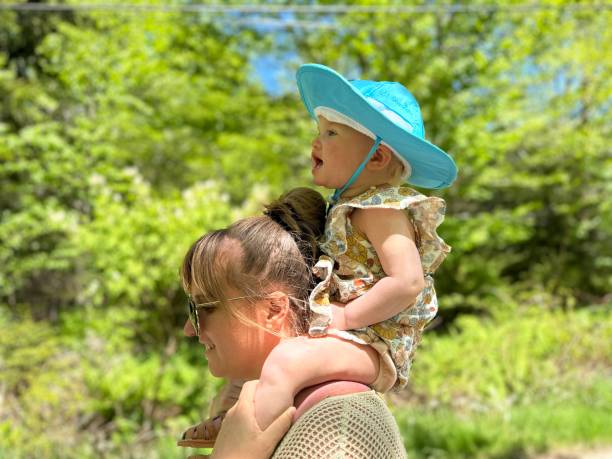 istock Mother Hiking With Baby on her Shoulders 2162133697