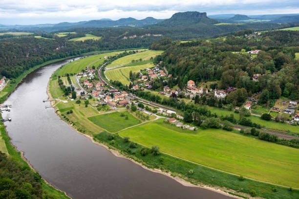 istock A river runs through a town with houses and a bridge 2162134766
