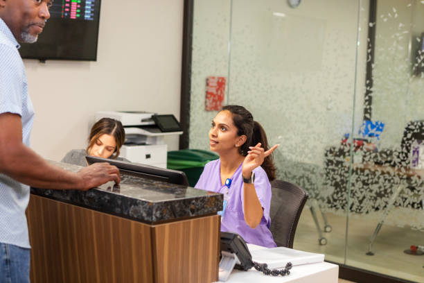 istock Unrecognizable man stops by nurses' station for directions 2162134774