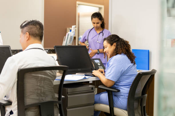 istock Hospital staff work at nurses' station 2162134780