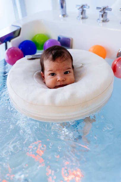 istock Baby swimming in a pool 2162134945