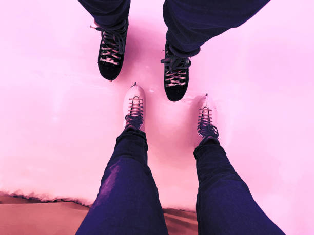 Young couple enjoying and relaxing ice skating together