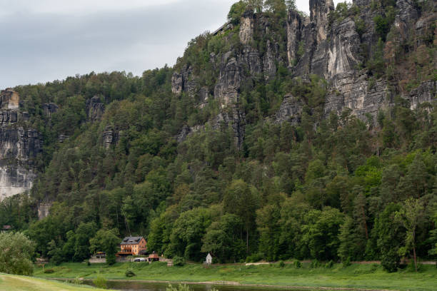 istock A mountain range with a house in the middle of it 2162136323