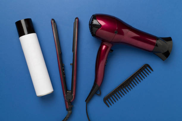 istock Hair tools with thermo protection on color background, top, view 2162136384