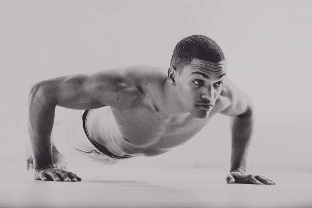 istock Black boxer doing push-ups, vintage 1950s style 2162136892