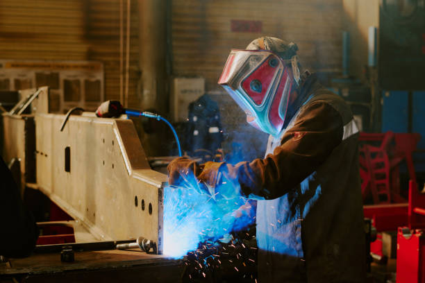 istock Unrecognizable Man Doing Metalwork In Factory 2162136951