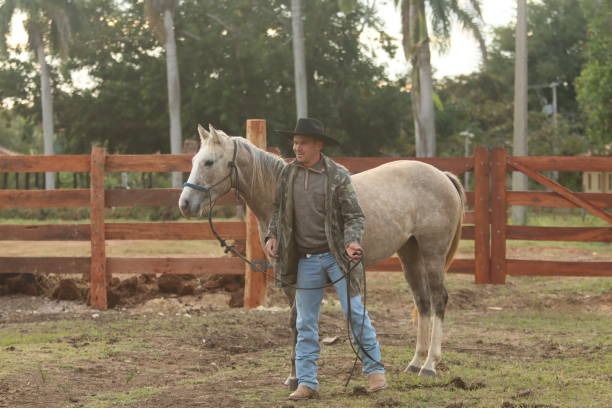 istock cowboy taking care of cattle 2162136966