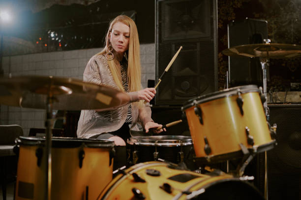 istock Young Woman Playing Drums 2162138112