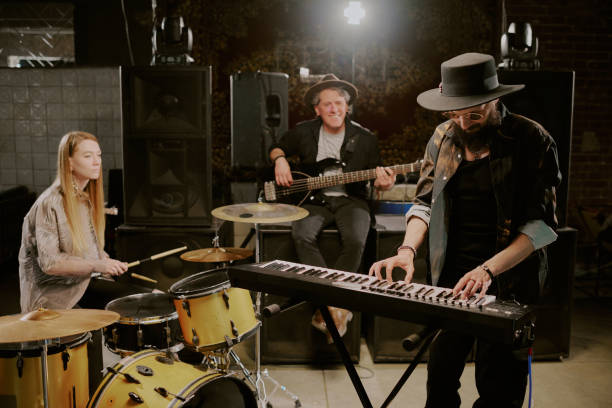 istock Men And Woman Playing In Band 2162138163