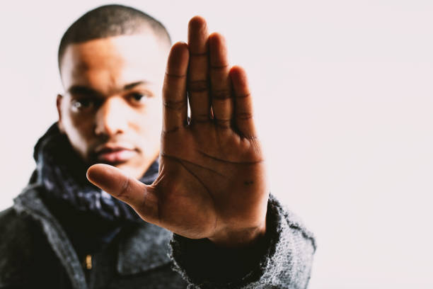istock Man raising hand, signaling caution or stop 2162138223
