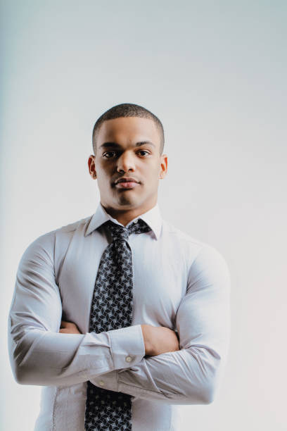 Serious man with arms crossed, professional demeanor