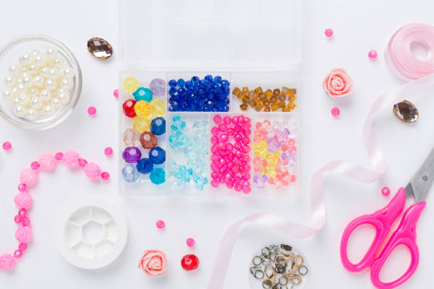 istock Tools and beads for making handmade jewelry on color background, top view 2162138794