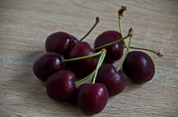 istock Heap of many ripe red cherries with stems 2162139192