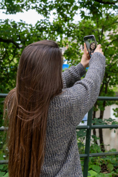istock Young brown-haired woman taking a selfie. 2162140743
