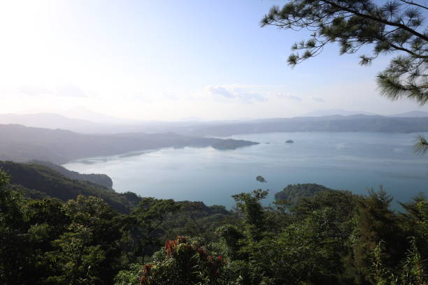 istock Beautiful view of a lake surrounded by a forest 2162141822