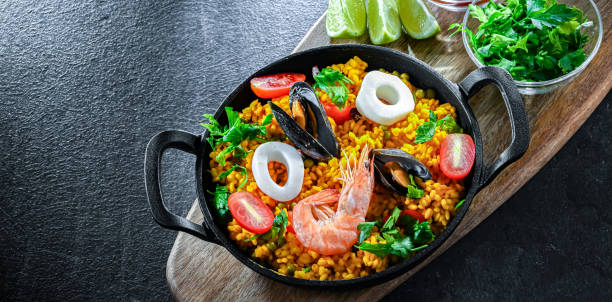 istock Seafood paella served in a cast iron pan 2162142078