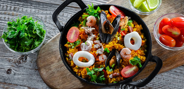istock Seafood paella served in a cast iron pan 2162142152