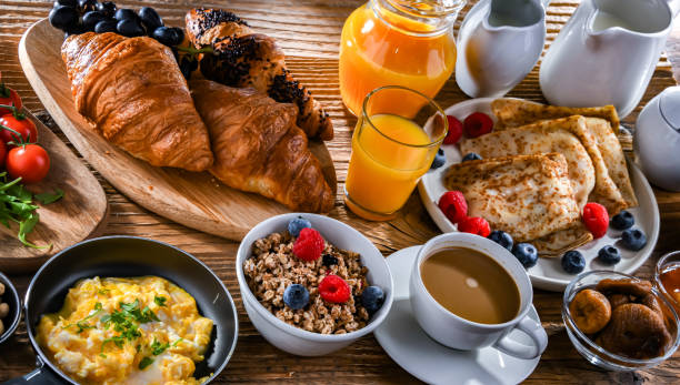 istock Breakfast served with coffee, eggs, cereals nd croissants 2162142452