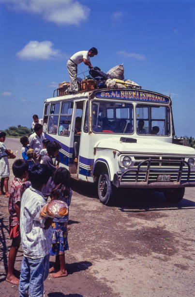 Piura, Peru - July 8, 2024: Bus with passengers at a border crossing with Ecuador