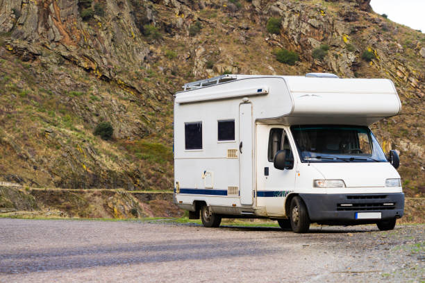 istock Camper rv camping on mountain nature 2162146962