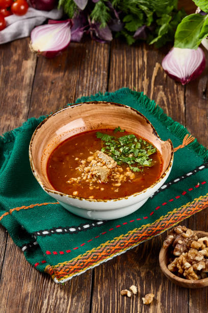 istock Traditional Kharcho Soup with Veal Garnished with Herbs in Rustic Wooden Setting 2162147146
