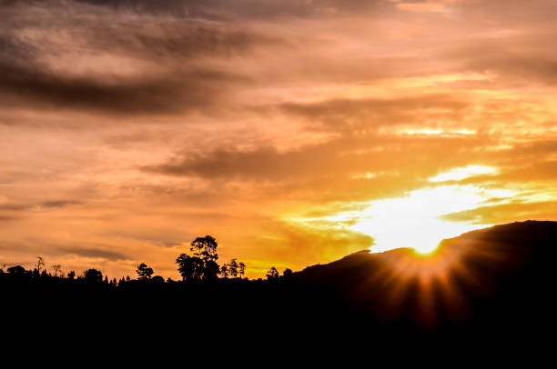 istock A beautiful sunset with a bright sun shining through the clouds 2162150632