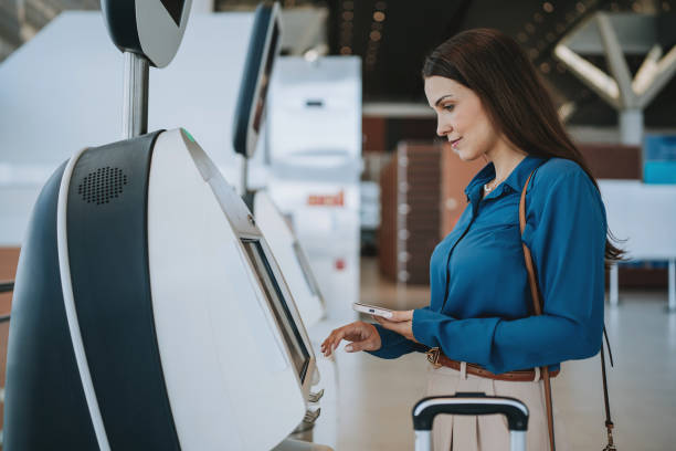 istock Woman checking in at the airport 2162152155