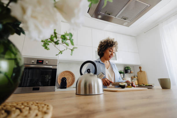 istock Woman making coffee and avocado sandwich for breakfast 2162152228