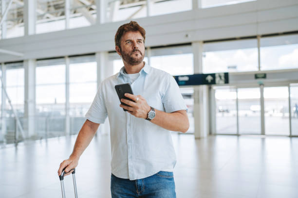 istock Man at airport traveling alone 2162152700