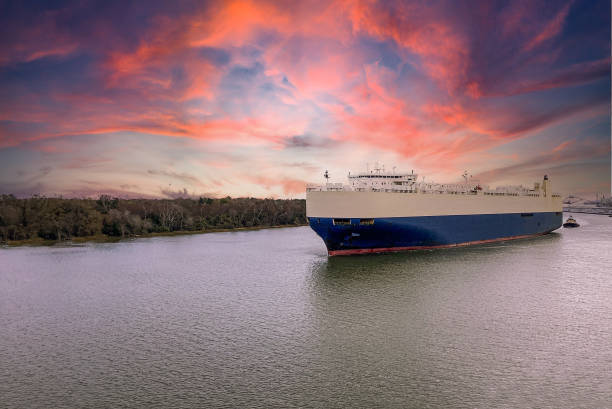 A Tanker makes its way to port on the Savannah River at sunrise in Savannah, Georgia