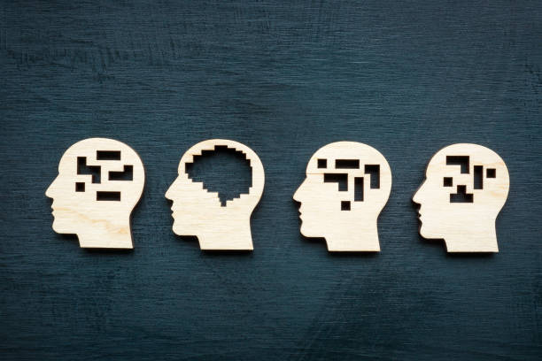 istock Lateral or logical thinking. Figures of heads with a brain. 2162155798