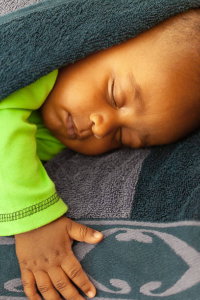 baby boy sleeping isolated on white background