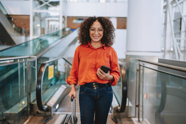 istock Portrait woman escalator 2162158525